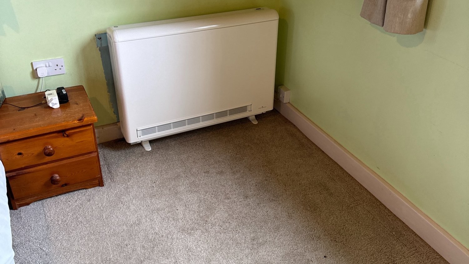 Storage heater installed in bedroom